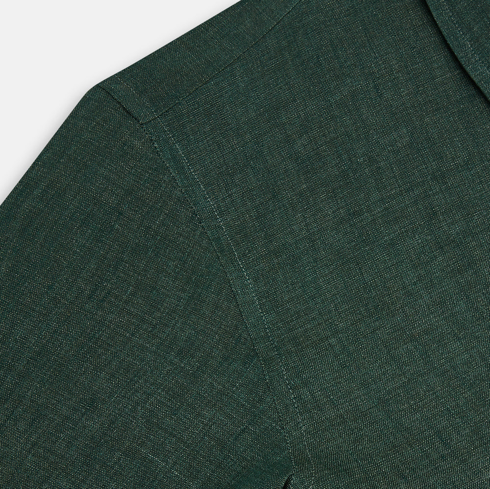 The Forest Green Linen Westminster Shirt by Turnbull & Asser features long sleeves, a Turnbull collar, and a button-up design, shown laid flat on a white background.