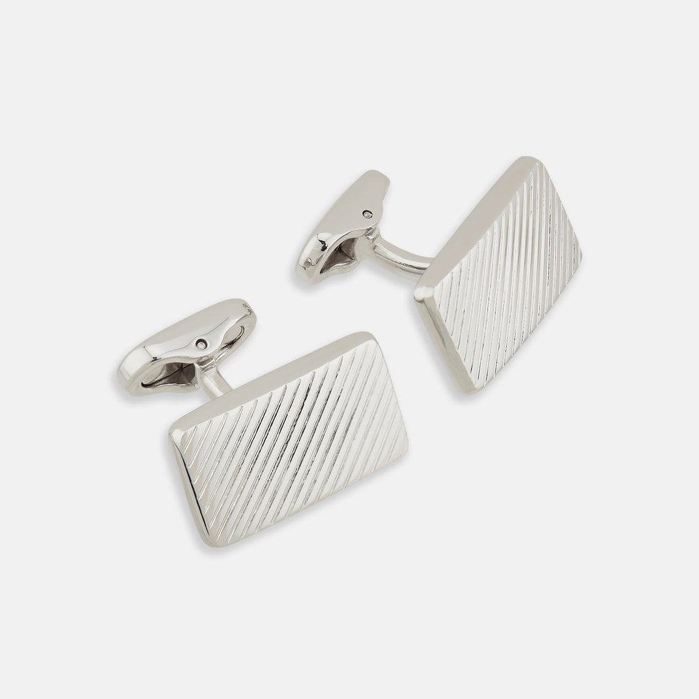 Turnbull & Asser's Silver Diagonal Striped Rectangular Cufflinks feature a sleek sterling silver design with diagonal stripes, displayed against a plain white background.