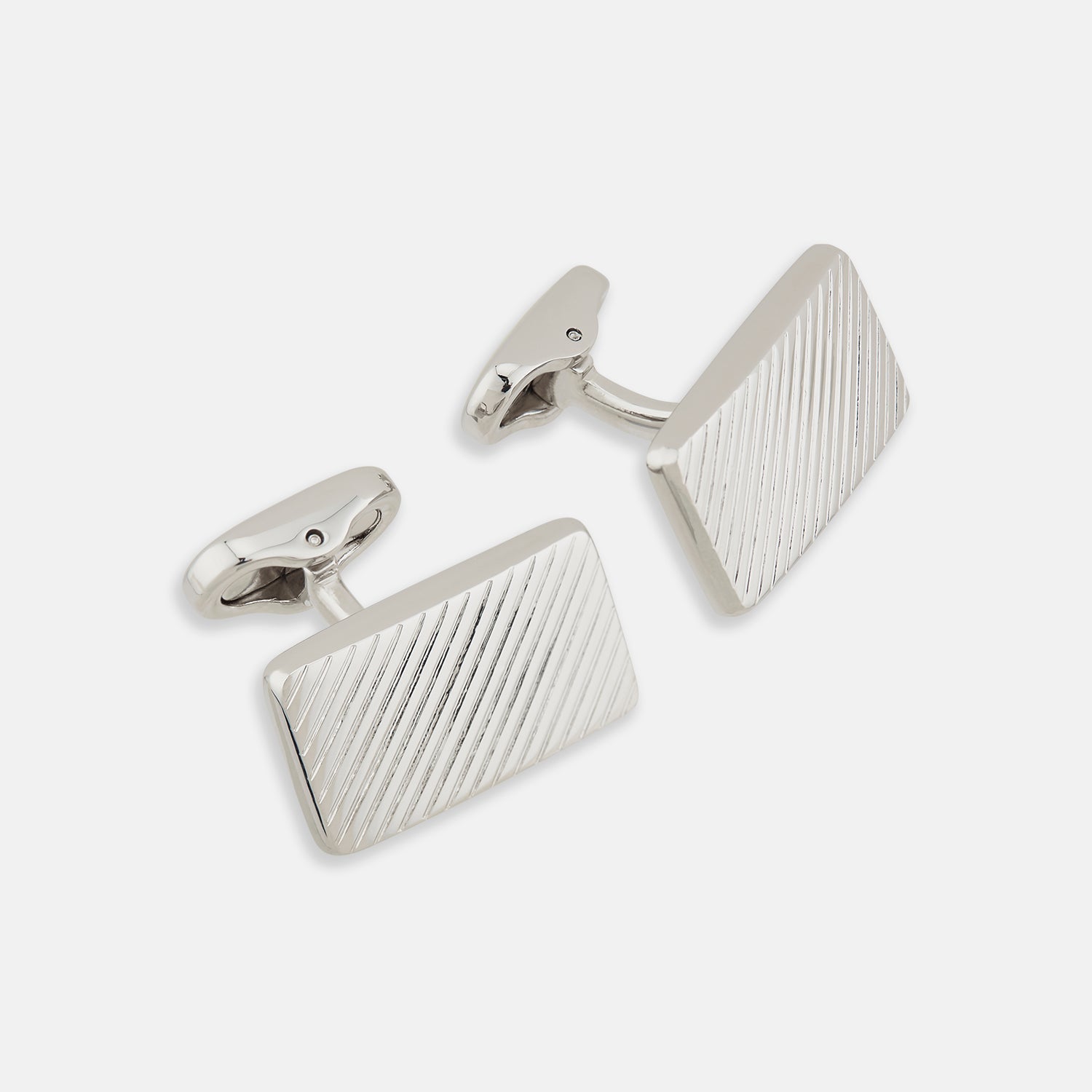 View 1 of product Turnbull & Asser's Silver Diagonal Striped Rectangular Cufflinks feature a sleek sterling silver design with diagonal stripes, displayed against a plain white background.