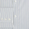 View 4 of product The Turnbull & Asser Brown and Blue Shadow Stripe Mayfair Shirt, featuring long sleeves, a pointed collar, and buttoned cuffs, is crafted from Italian fabric with vertical stripes and shown laid flat on a white background.