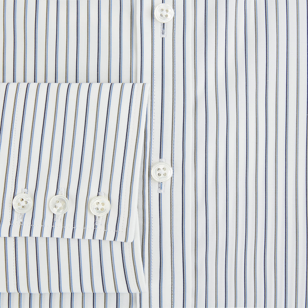 The Turnbull & Asser Brown and Blue Shadow Stripe Mayfair Shirt, featuring long sleeves, a pointed collar, and buttoned cuffs, is crafted from Italian fabric with vertical stripes and shown laid flat on a white background.
