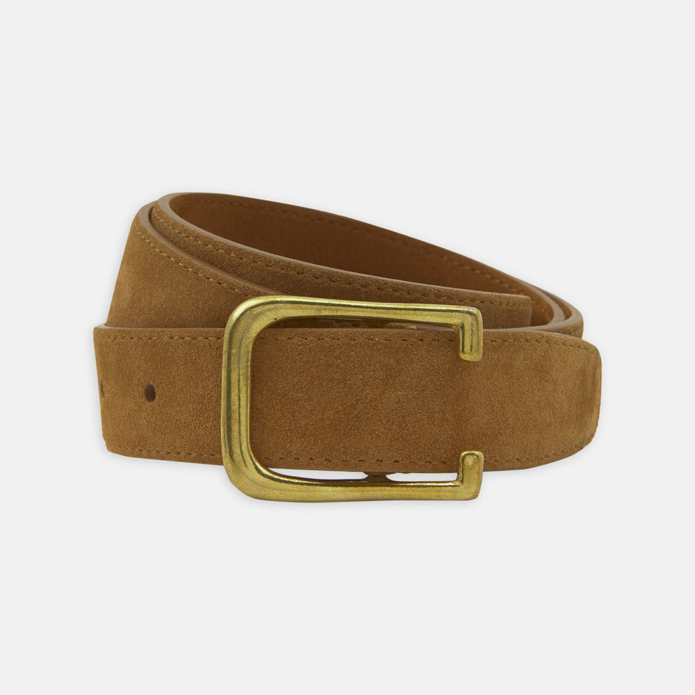 The Turnbull & Asser Brown Suede Leather Belt, featuring a rectangular gold buckle and shown partially rolled on a white background, is a versatile accessory for any casual outfit.