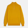 View 1 of product Close-up of the Gold Lennox Cashmere Half-Zip Jumper by Turnbull & Asser, featuring a mustard yellow knit, high ribbed collar, and silver center zipper—expertly crafted in Scotland.