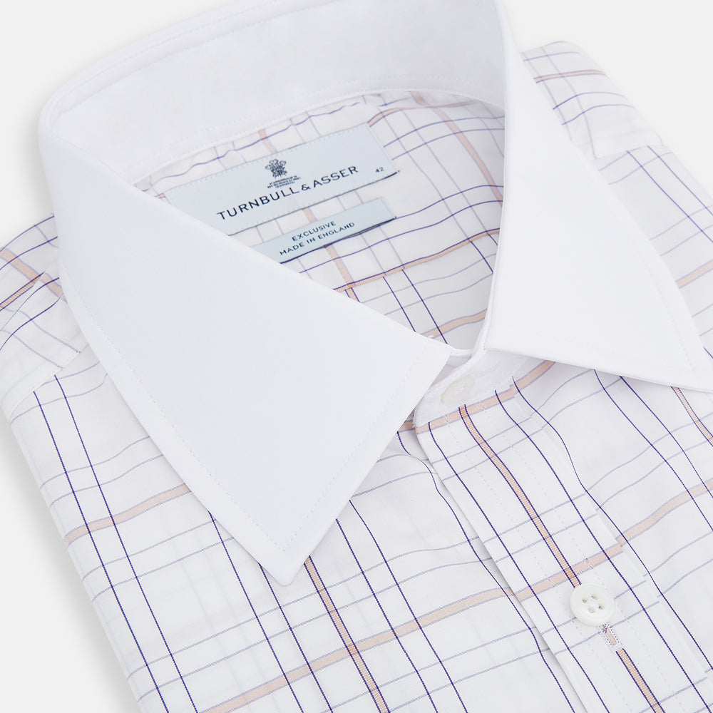 The Turnbull & Asser Purple Multi Plaid Check Shirt features a spread collar, double cuffs, and a fitted silhouette. Its bold plaid pattern and contrast collar add a modern touch to classic British style. Displayed on a plain white background.