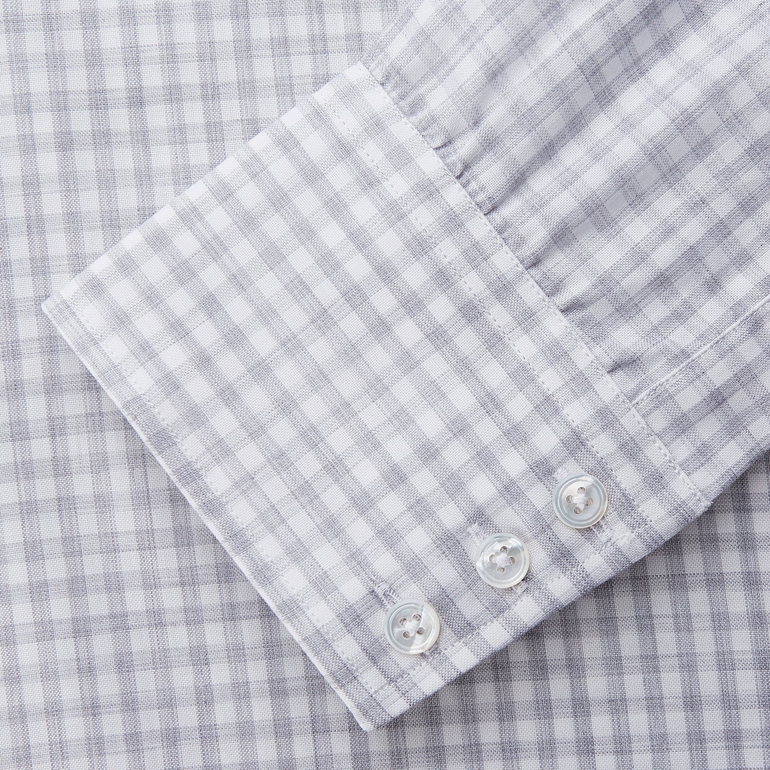 View 3 of product The Grey Check Cotton Melange Regular Fit Mayfair Shirt by Turnbull & Asser features a light gray and white small checkered pattern, a collar, and front buttons, shown against a white background.