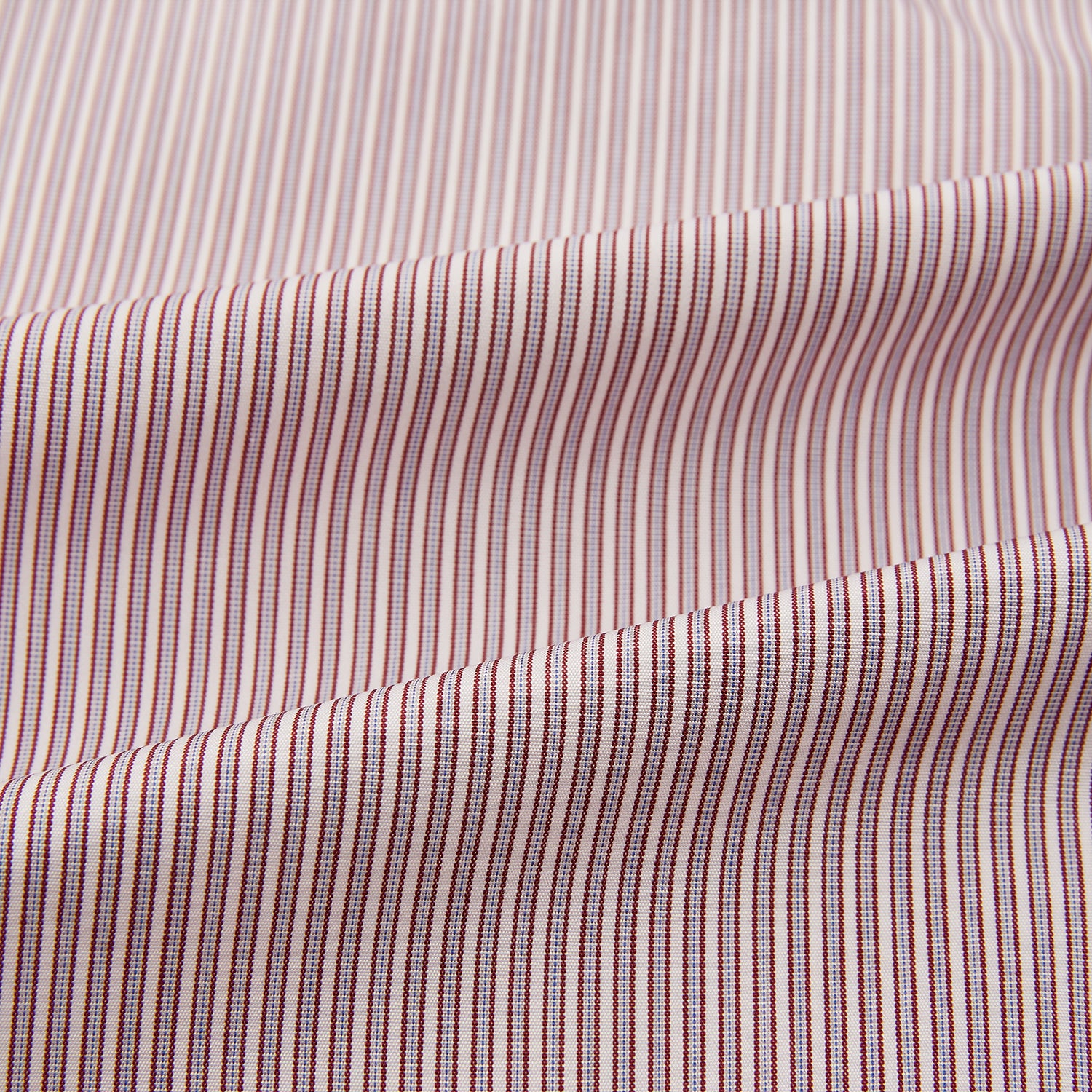 View 6 of product A Red and Pink Ticking Stripe Mayfair Shirt by Turnbull & Asser, featuring a classic T&A collar, buttoned cuffs, and subtle vertical pinstripes, shown on a white background.