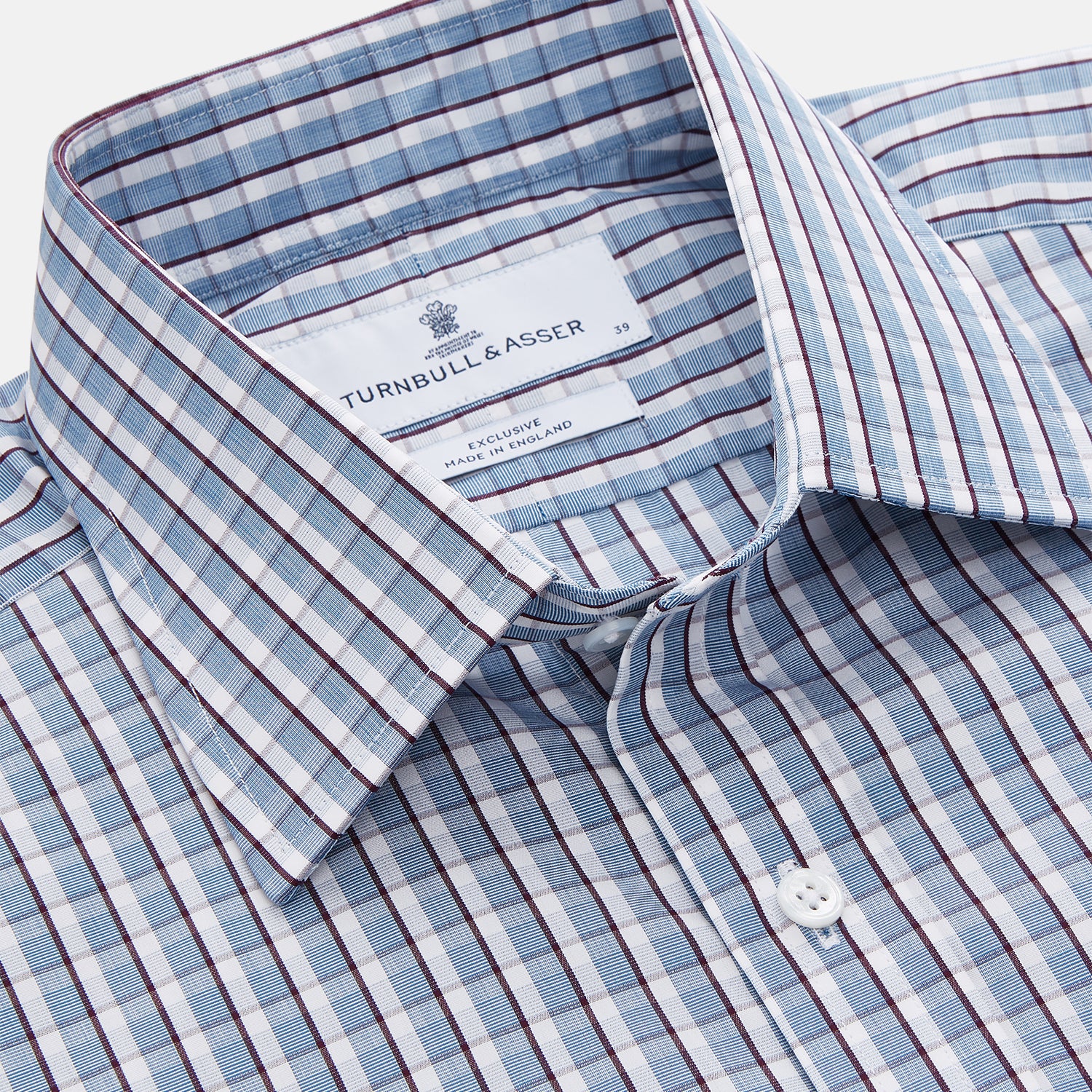 View 4 of product The Turnbull & Asser Blue and White Check Cotton Regular Fit Mayfair Shirt features long sleeves, a pointed collar, and buttoned cuffs, shown here on a white background.
