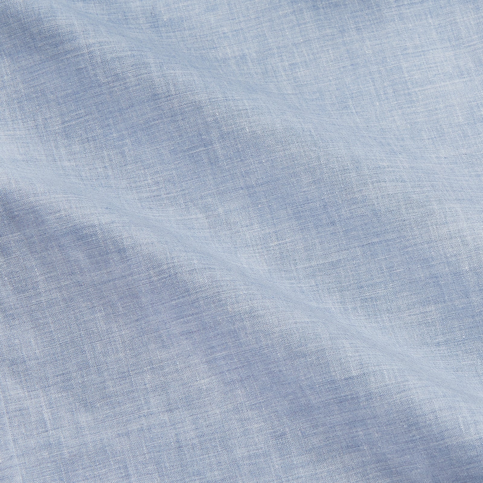 View 4 of product Turnbull & Asser’s Pale Blue Linen Blend Weekend Fit Unwin Shirt features long sleeves, a band collar, two chest pockets, and white buttons—ideal for casual summer wear.