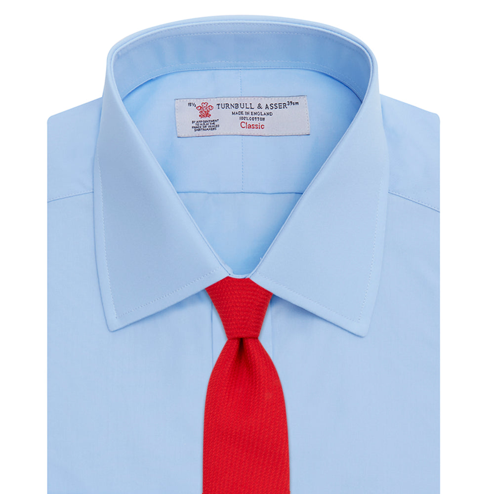 A Light Blue Cotton Shirt with a T&A collar and 3-button cuffs by Turnbull & Asser is displayed on a plain white background, ideal for pairing with a navy suit.