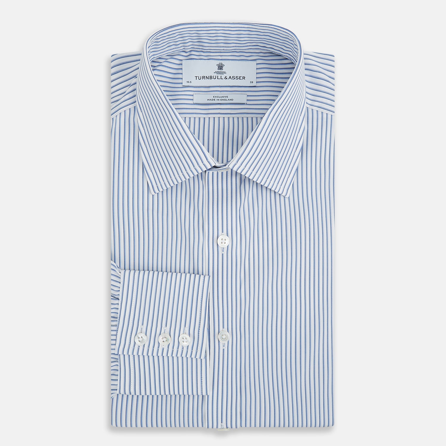 View 5 of product The Turnbull & Asser Blue Shadow Stripe Mayfair Shirt is a long-sleeve button-up with a T&A collar and thin blue vertical stripes on white, shown on a plain white background.