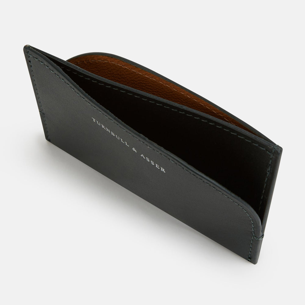 A forest green slim leather card case by Turnbull & Asser with the brand name in white on the front, visible stitching, and a curved pocket design on the right side.
