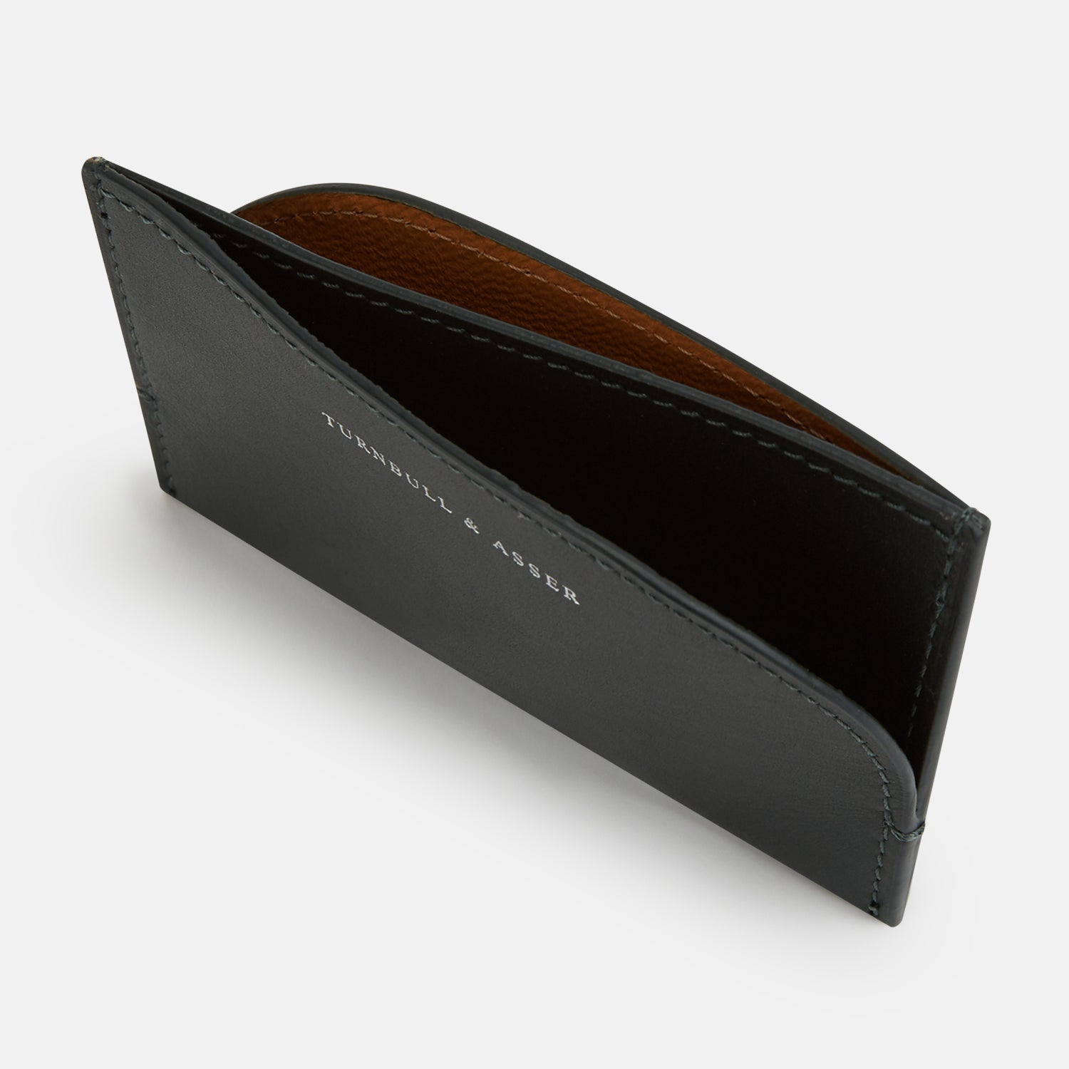 View 2 of product A forest green slim leather card case by Turnbull & Asser with the brand name in white on the front, visible stitching, and a curved pocket design on the right side.