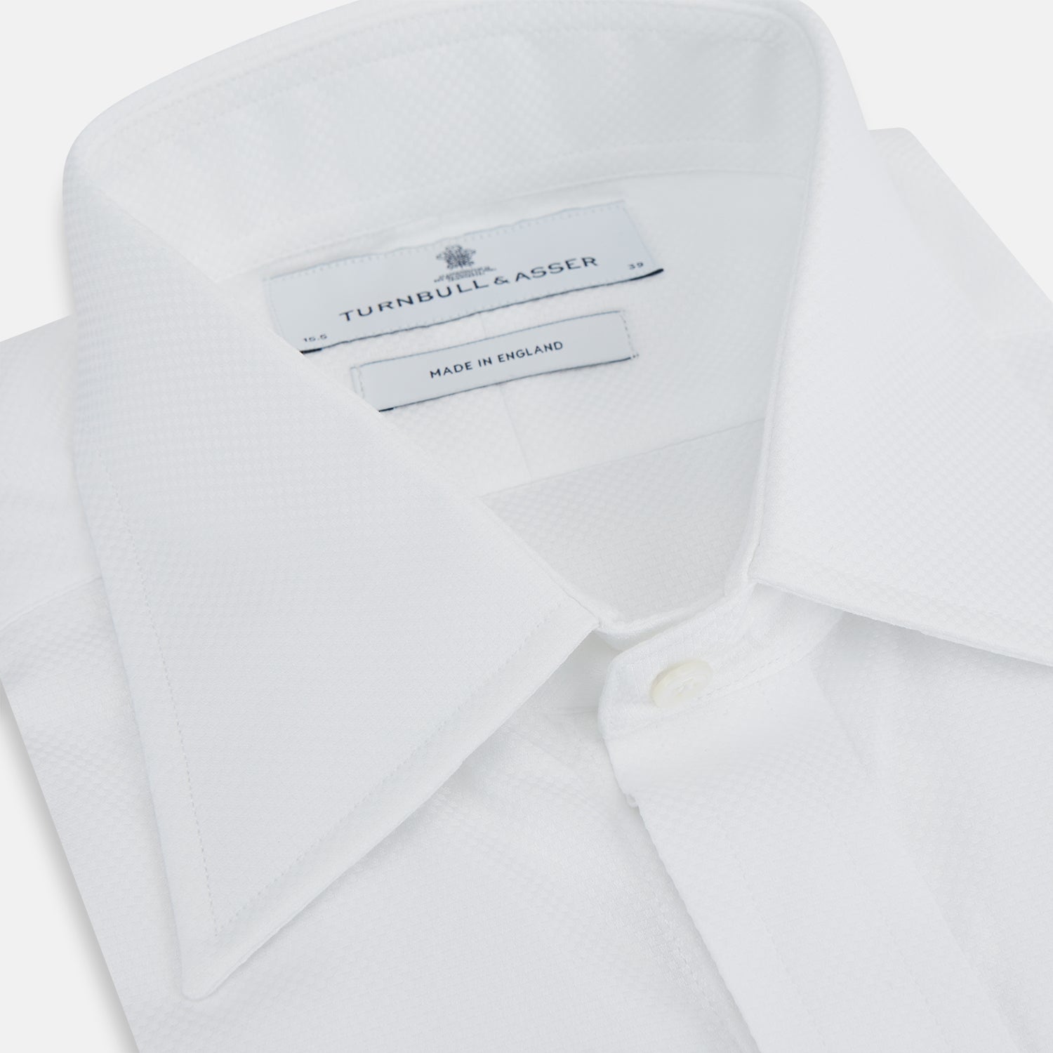 View 2 of product The Turnbull & Asser Casino Royale White Dress Shirt, as seen on James Bond, features a classic Bond collar, button-down front, and buttoned cuffs, shown on a white background.