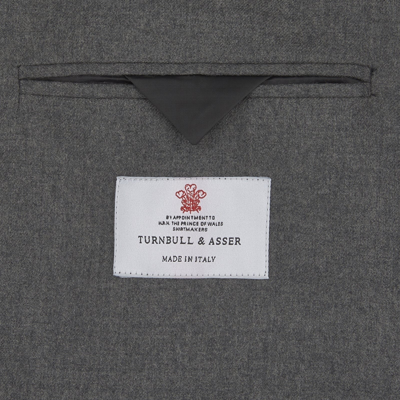 View 5 of product The Turnbull & Asser Grey Merino Wool Jacket is single-breasted with a notched lapel, two front patch pockets, and a single button closure, fashioned from fine Super Merino Wool. Shown here against a plain white background.