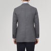 View 3 of product The Turnbull & Asser Grey Merino Wool Jacket is single-breasted with a notched lapel, two front patch pockets, and a single button closure, fashioned from fine Super Merino Wool. Shown here against a plain white background.