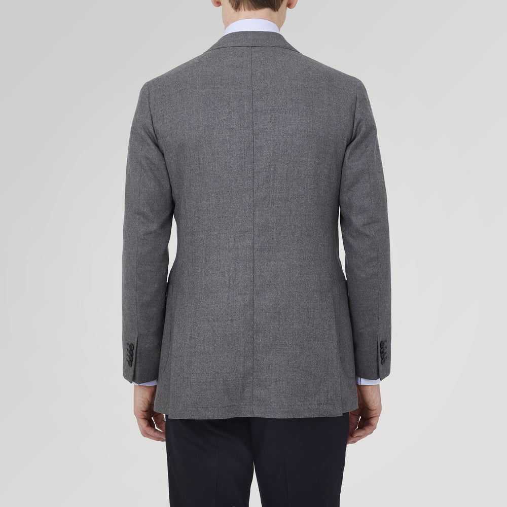 The Turnbull & Asser Grey Merino Wool Jacket is single-breasted with a notched lapel, two front patch pockets, and a single button closure, fashioned from fine Super Merino Wool. Shown here against a plain white background.