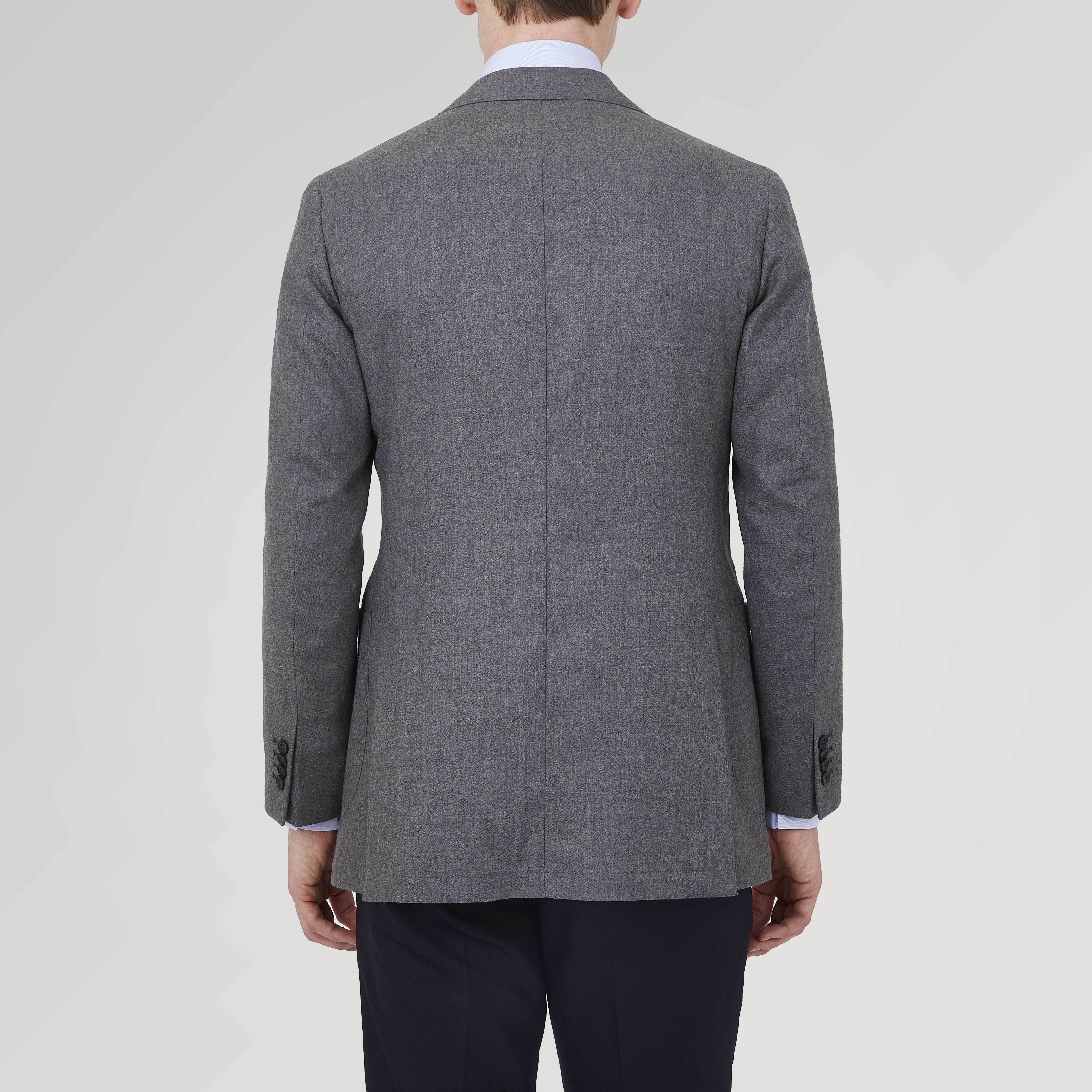 View 3 of product The Turnbull & Asser Grey Merino Wool Jacket is single-breasted with a notched lapel, two front patch pockets, and a single button closure, fashioned from fine Super Merino Wool. Shown here against a plain white background.