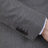 View 4 of product The Turnbull & Asser Grey Merino Wool Jacket is single-breasted with a notched lapel, two front patch pockets, and a single button closure, fashioned from fine Super Merino Wool. Shown here against a plain white background.