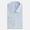 View 5 of product The Pale Blue Mayfair Shirt by Turnbull & Asser is a long-sleeve, button-up dress shirt with a pointed collar and buttoned cuffs, crafted from sanforised cotton and shown laid flat on a white background.