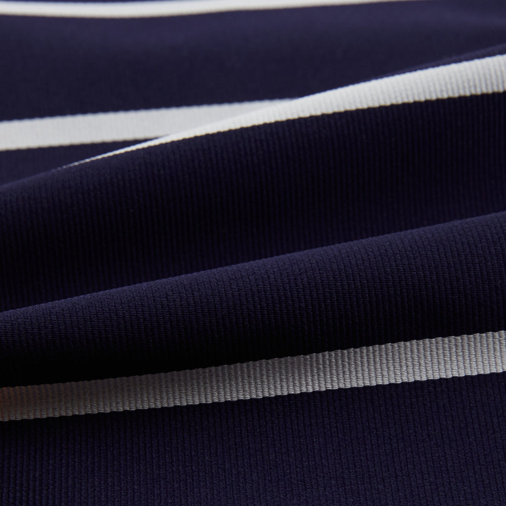 The Turnbull & Asser Silver Stripe and Navy Silk Cravat features two horizontal white stripes on navy silk, offering a sophisticated British-inspired design—ideal as a unique wedding accessory.