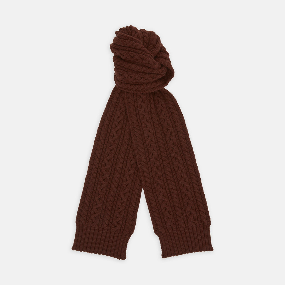 The Turnbull & Asser Red Grouse Cable Knit Cashmere Scarf, featuring ribbed ends, is neatly folded against a white background.