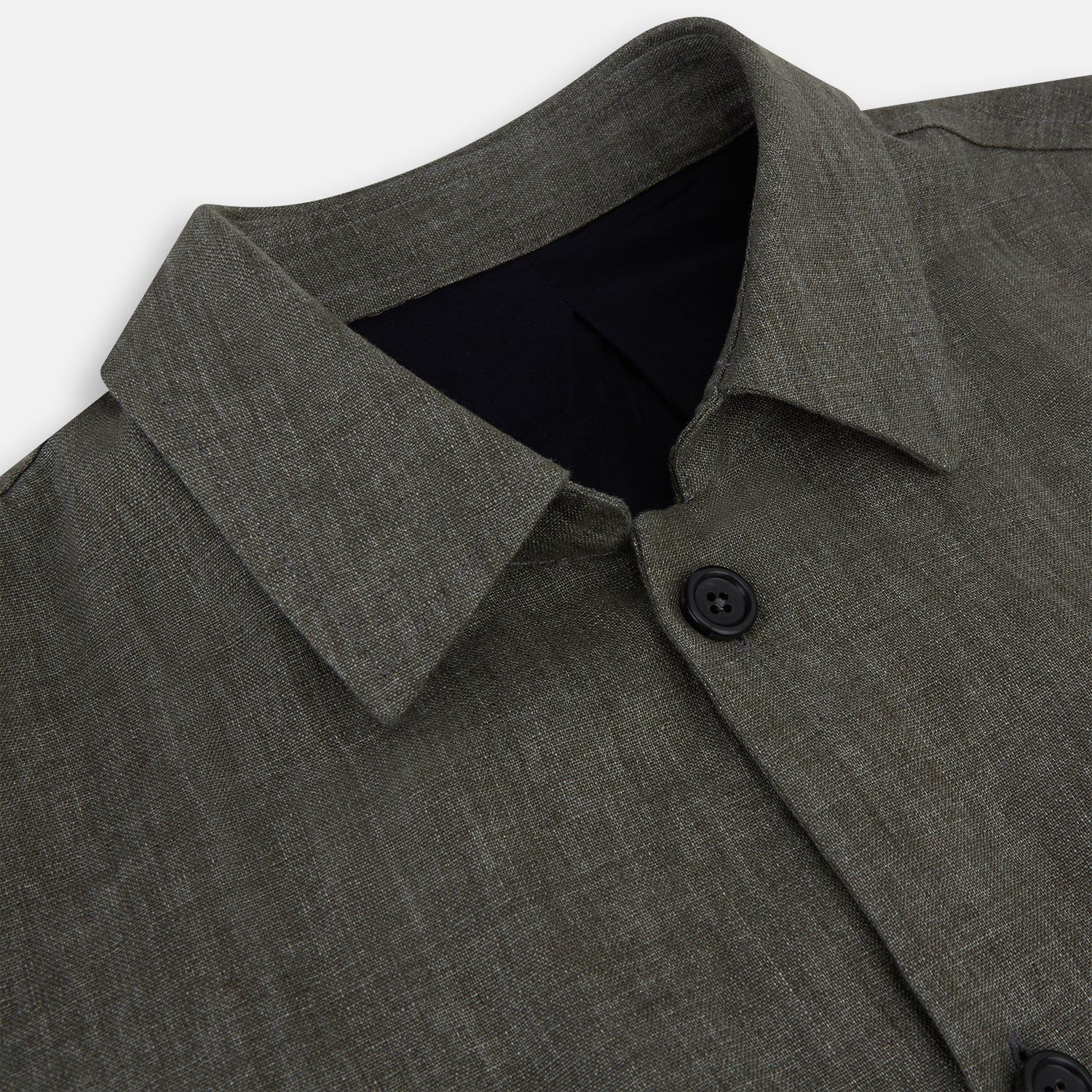View 2 of product The Olive Linen Holland Shacket by Turnbull & Asser is a lightweight olive button-up jacket in Irish linen with a collar, two front pockets, one chest pocket, and slanted hem pockets—ideal outerwear shown on a plain white background.
