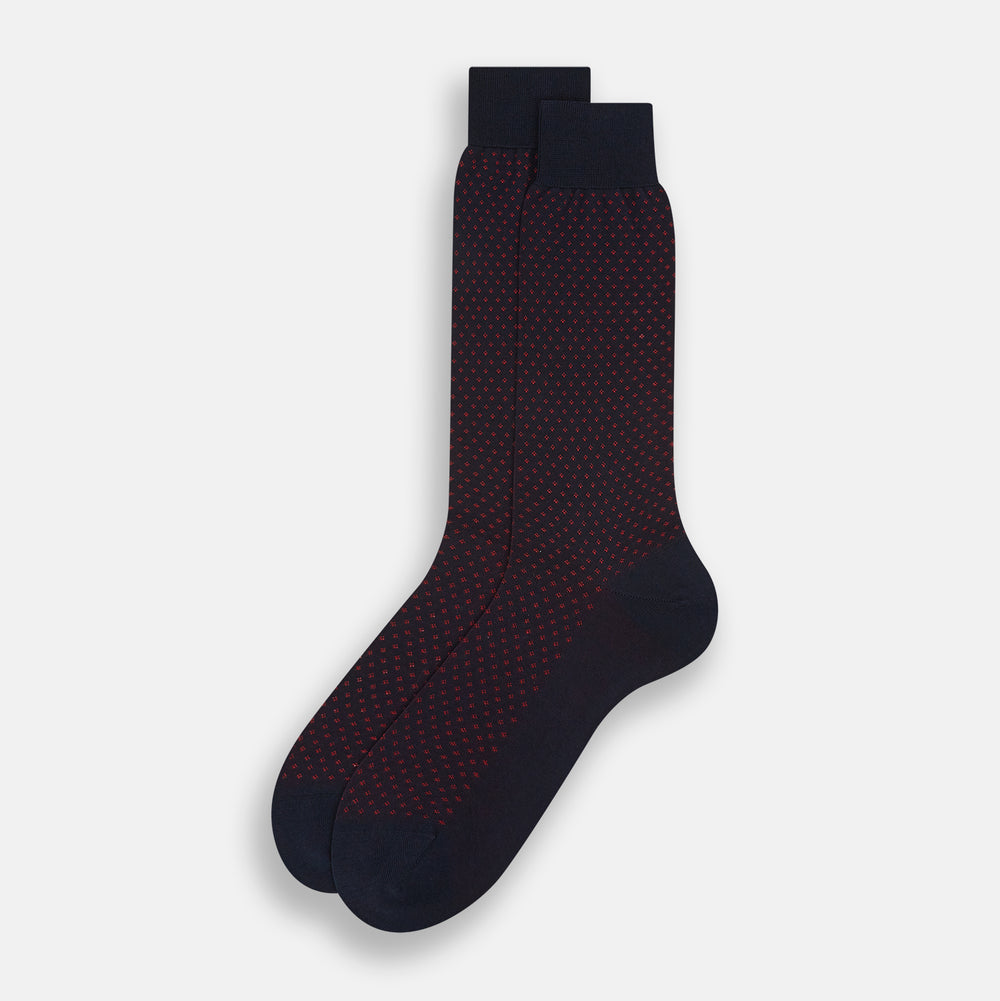 A single Navy/Red Motif Mid-Length Sock by Turnbull & Asser, displayed upright on a white background. The sock features a calf-length style, ribbed cuff, hand-linked toe for comfort, and a subtle red pattern.