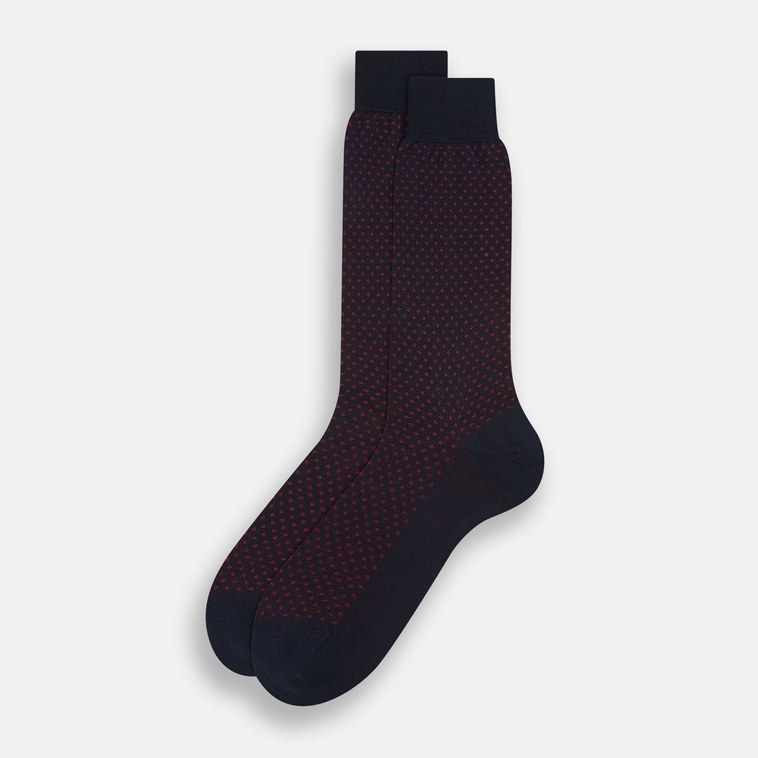 View 2 of product A single Navy/Red Motif Mid-Length Sock by Turnbull & Asser, displayed upright on a white background. The sock features a calf-length style, ribbed cuff, hand-linked toe for comfort, and a subtle red pattern.