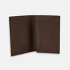 View 2 of product The Dark Brown Leather Bi-Fold Card Holder by Turnbull & Asser features neat edge stitching and the brand's name embossed in white on the front.