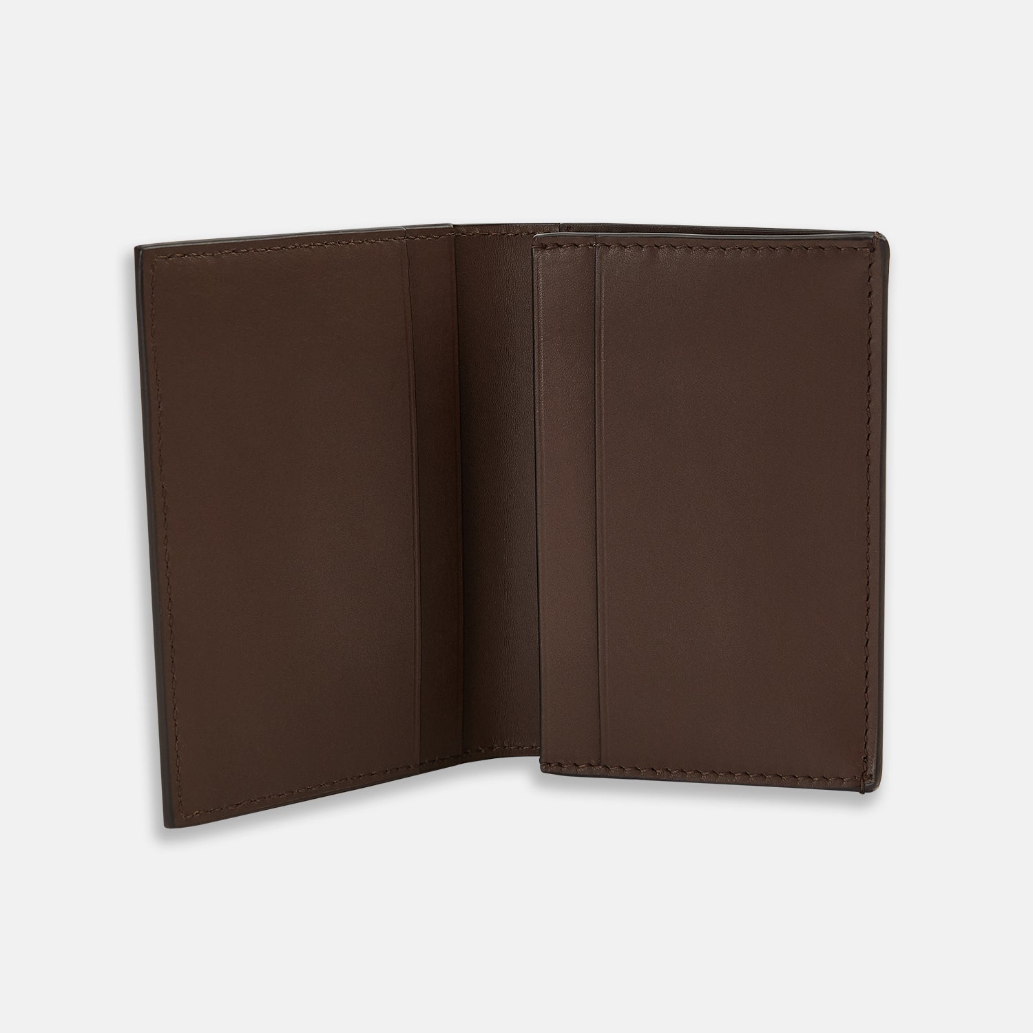 View 2 of product The Dark Brown Leather Bi-Fold Card Holder by Turnbull & Asser features neat edge stitching and the brand's name embossed in white on the front.