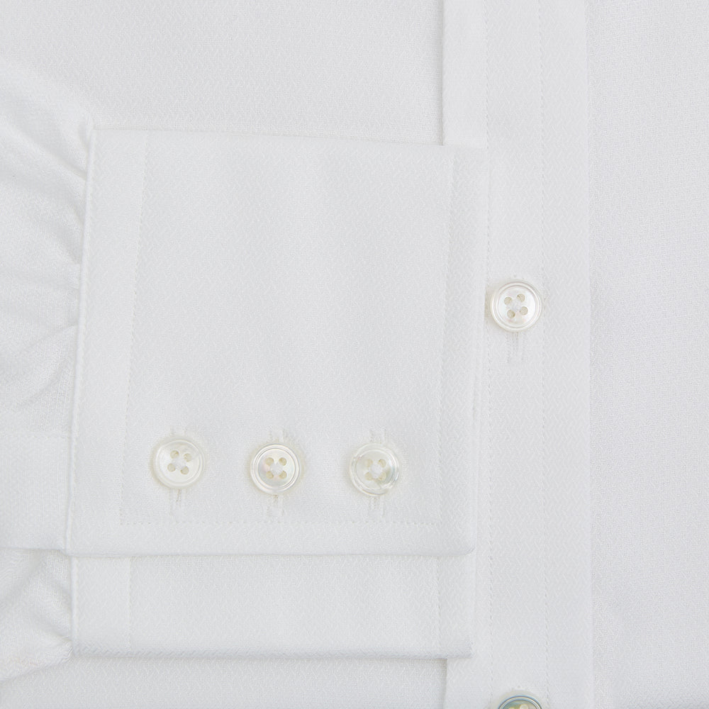 The Turnbull & Asser White Herringbone Mayfair Shirt features long sleeves and a classic collar—a timeless wardrobe essential, shown here against a white background.