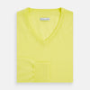 View 4 of product The Turnbull & Asser Bright Yellow Cashmere V-neck Jumper, a plain long-sleeved knitwear sweater, is showcased against a white background.