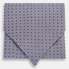 View 1 of product A light gray pocket square with small black polka dots pairs perfectly with the Turnbull & Asser Navy and Light Blue Micro Dot Silk Cravat for a refined, polished formal look.
