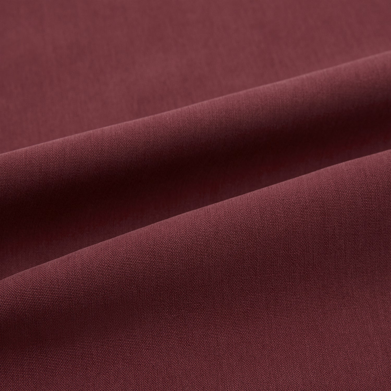 View 7 of product The Turnbull & Asser Burgundy Silk Pyjama Set features a long-sleeve, button-up shirt with chest pocket and matching pants with elastic waistband and side pocket, shown on a white background.