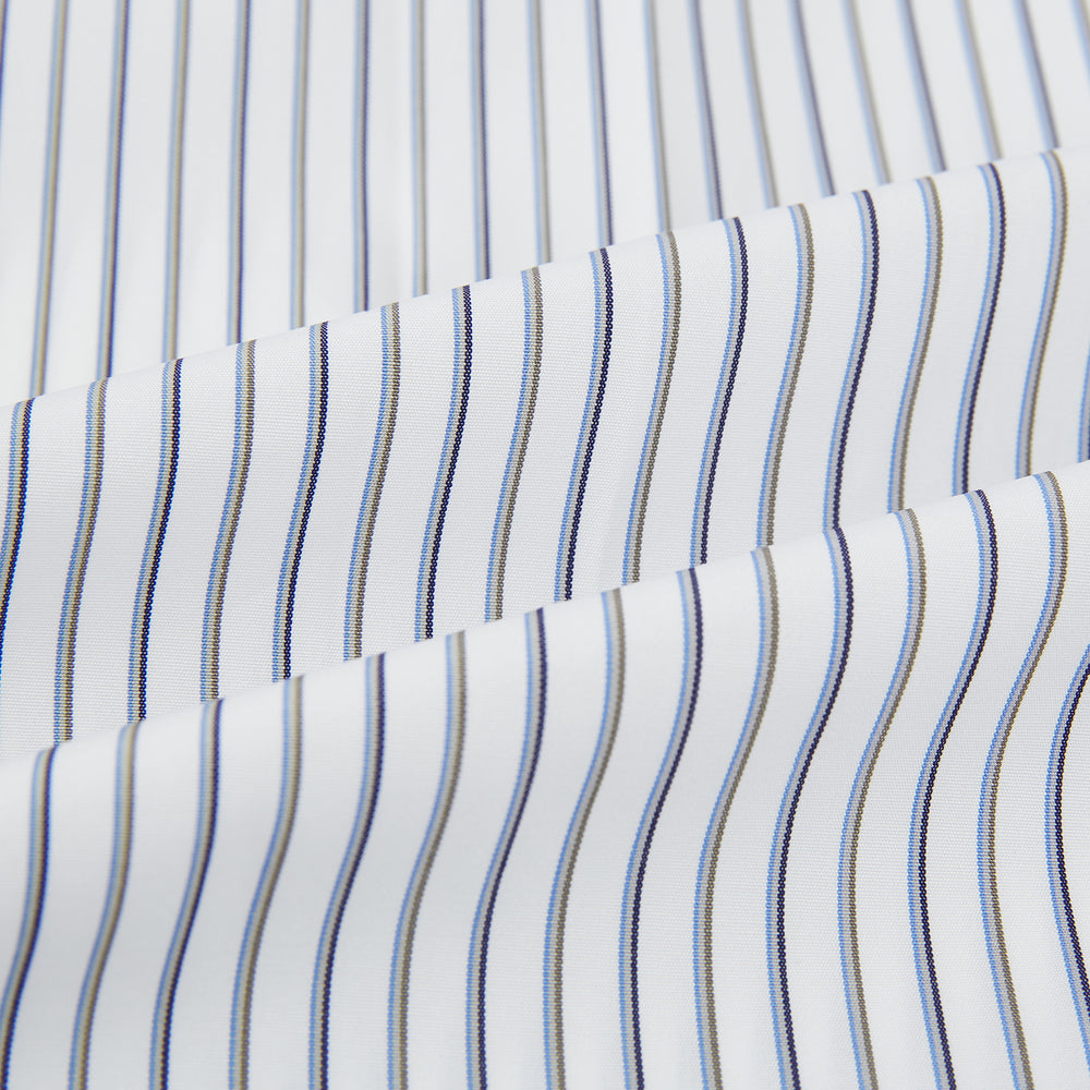 The Brown Multi Stripe Quarzo Nightshirt by Turnbull & Asser is a long-sleeve, knee-length Italian cotton nightshirt with brown and blue stripes, a collar, button placket, chest pocket, and cuffs. The dress is laid flat on a white background.