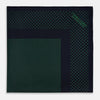 View 3 of product The Turnbull & Asser Navy and Green Dot Silk Pocket Square features dense green polka dots on navy silk, a solid navy border, and a band of spaced green dots—expertly handmade with precise finishing for an elegant look.
