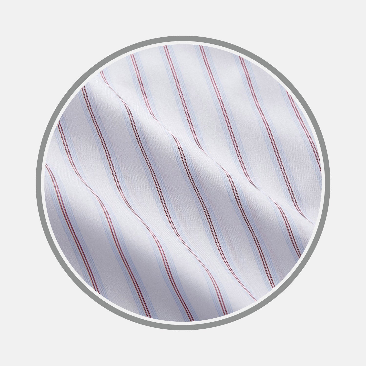 View 1 of product A close-up of Turnbull & Asser’s Red and Blue Multi Stripe Cotton Fabric, featuring evenly spaced thin blue and red stripes on white cotton, shown inside a circular frame on a light gray background.