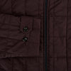 View 4 of product The Battersea Burgundy Quilted Jacket by Turnbull & Asser is a men's elegant outerwear featuring a front zipper, zippered side pockets, chest pocket, pointed collar, and buttoned cuffs, shown on a plain white background.