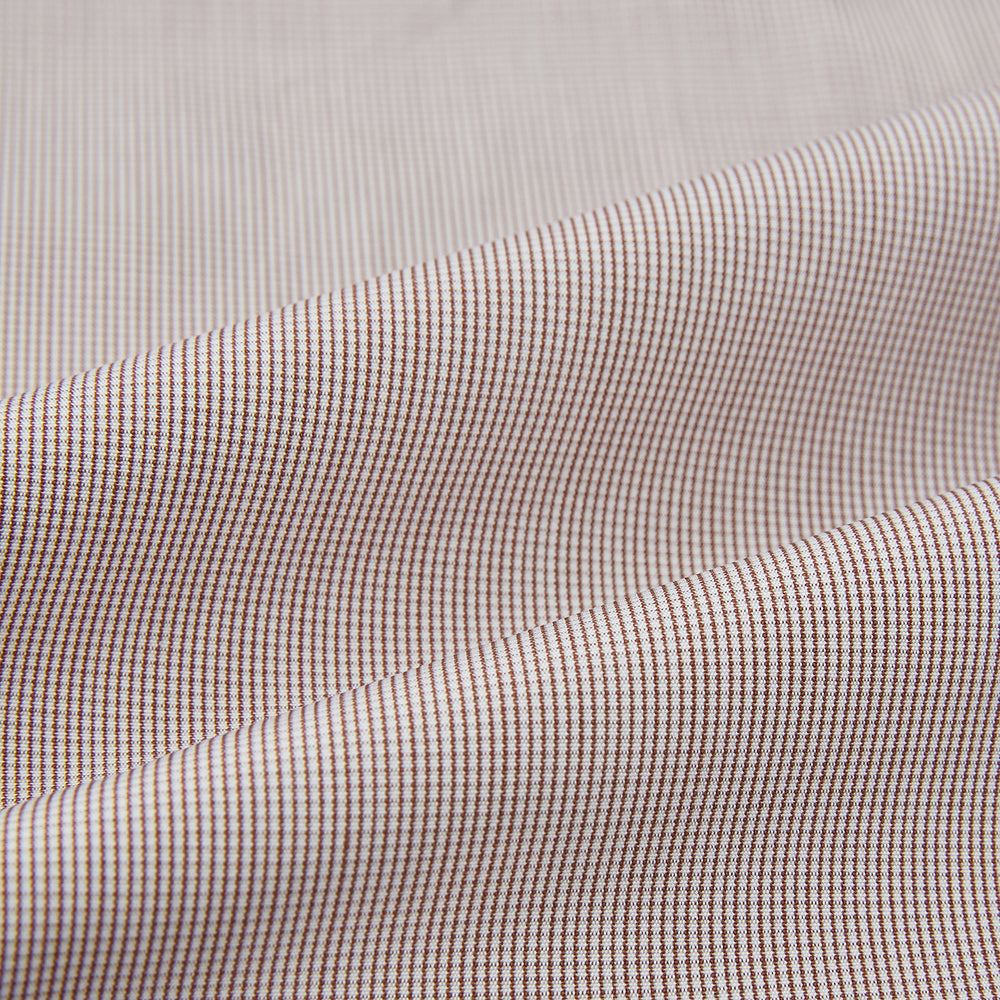 The Turnbull & Asser Brown Micro Check Quarzo Nightshirt is a long-sleeve shirt dress inspired by classic sleepwear, featuring a collar, chest pocket, upper front buttons, and a subtle micro check pattern on a white background.