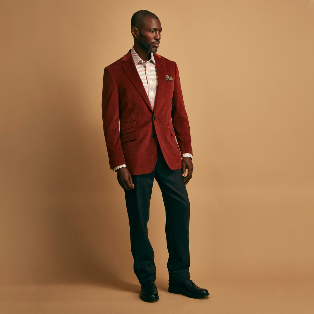 The Rust Cord Barrington Blazer by Turnbull & Asser is tailored in Italy with notch lapels, two front buttons, three pockets, and four-button cuffs, shown flat on a white background.