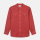 The Turnbull & Asser Plain Red Linen Weekend Fit Shirt with Stand Collar features long sleeves, a button-up front, and two buttoned-flap chest pockets. It is shown neatly laid flat on a plain light background.