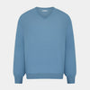 View 1 of product The Turnbull & Asser Pale Blue Fine Merino V-Neck Jumper features long sleeves, ribbed cuffs, and a straight hem. Shown against a white background, this classic knitwear combines comfort and style.