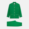 View 1 of product The Turnbull & Asser Green Silk Hyde Pyjamas Set features a long-sleeve button-up top with three pockets and modern fit elastic waistband pants in silk blend, both shown laid flat on a white background.
