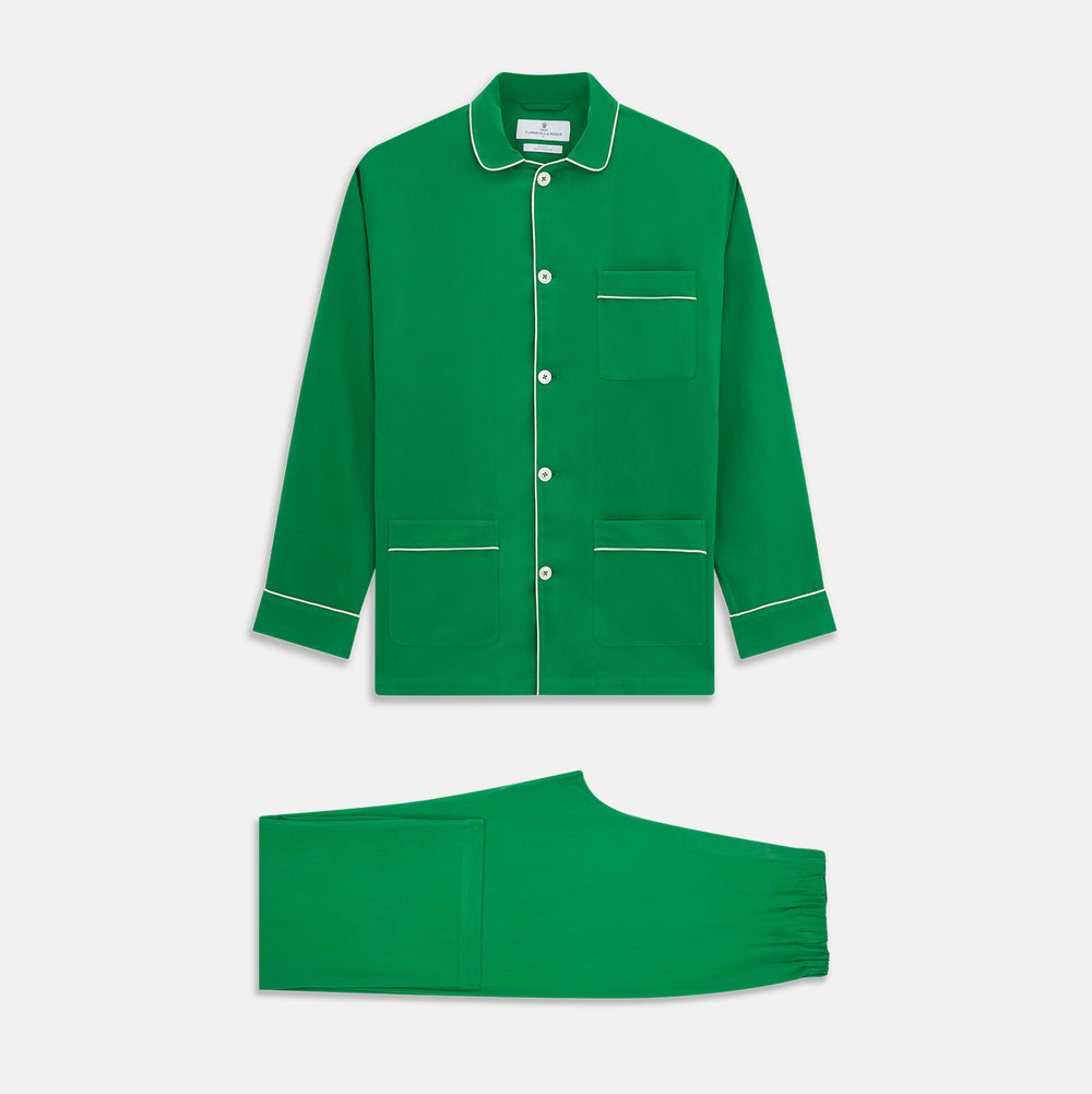 The Turnbull & Asser Green Silk Hyde Pyjamas Set features a long-sleeve button-up top with three pockets and modern fit elastic waistband pants in silk blend, both shown laid flat on a white background.