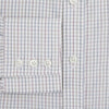 View 4 of product The Turnbull & Asser Sky Blue Multi Graph Check Shirt features long sleeves, a button-up front, pointed T&A collar, buttoned cuffs, and a small blue-and-white check pattern, shown on a white background.