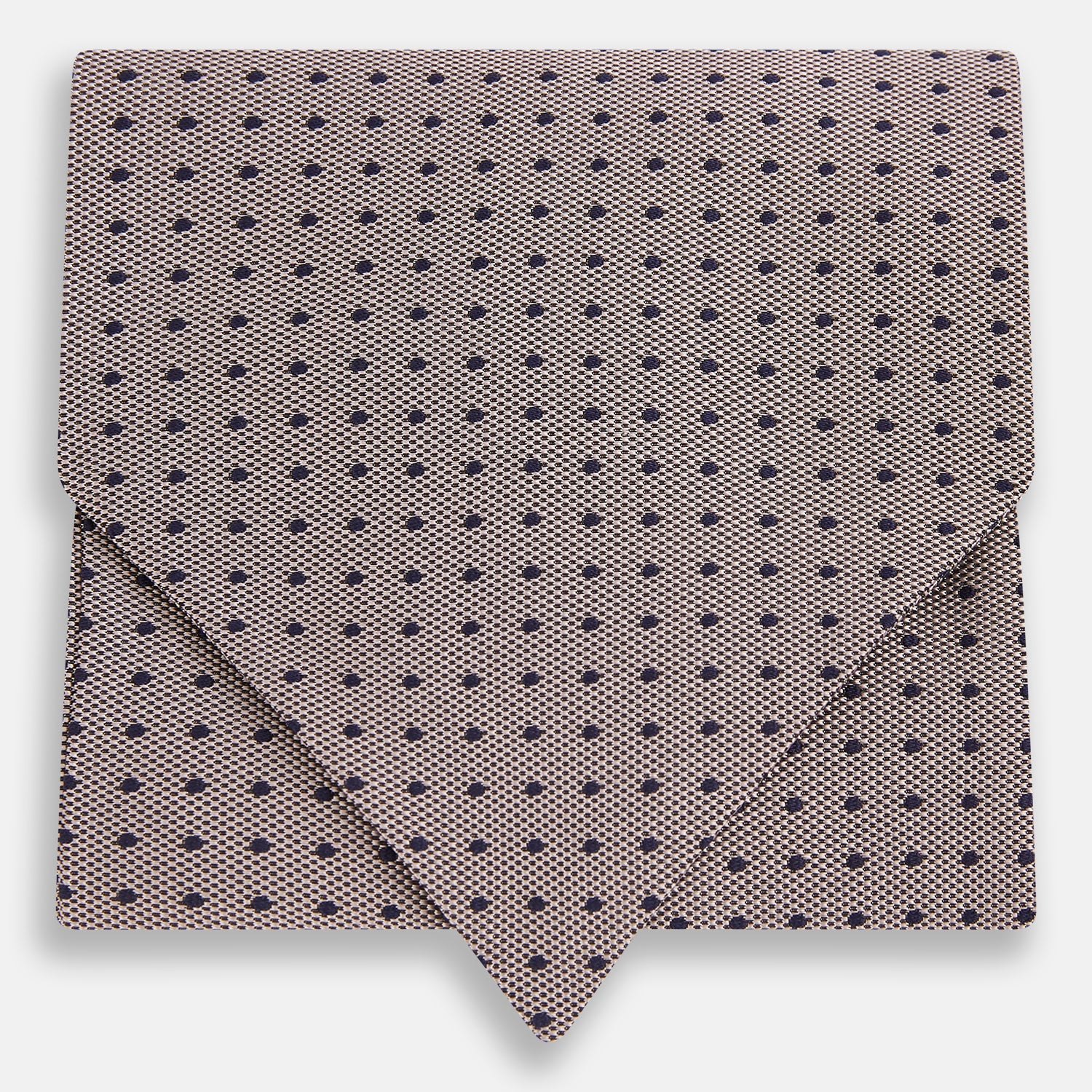 View 1 of product A folded, light-colored pocket square with small dark dots is displayed on a white background. Neatly arranged in a pointed fold, it pairs perfectly with the Turnbull & Asser Lilac and Navy Micro Dot Silk Cravat for an elegant look.