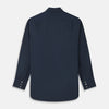 View 5 of product The Turnbull & Asser Navy Cotton Regular Fit Mayfair Shirt is a long-sleeved men’s formal shirt with a collar and white buttons, shown against a plain white background.