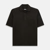 View 1 of product A brown cotton jersey polo shirt by Turnbull & Asser with short sleeves, a collar, three buttons, and a buttoned chest pocket, laid flat on a white background.