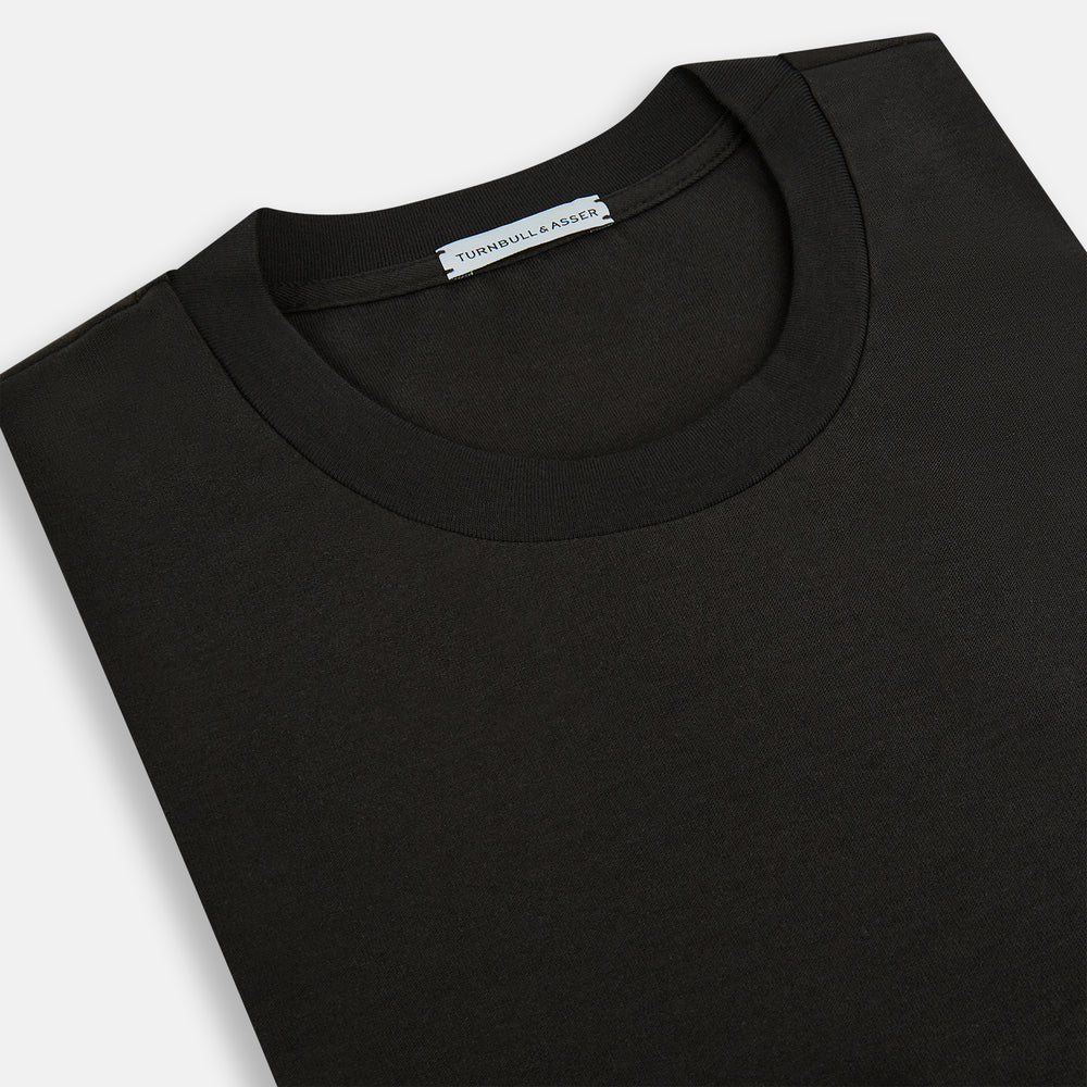 The Dark Chocolate Long-Sleeve T-shirt by Turnbull & Asser, featuring a plain crew neck design with no visible logos, is laid flat on a white background to showcase its quality and versatility.