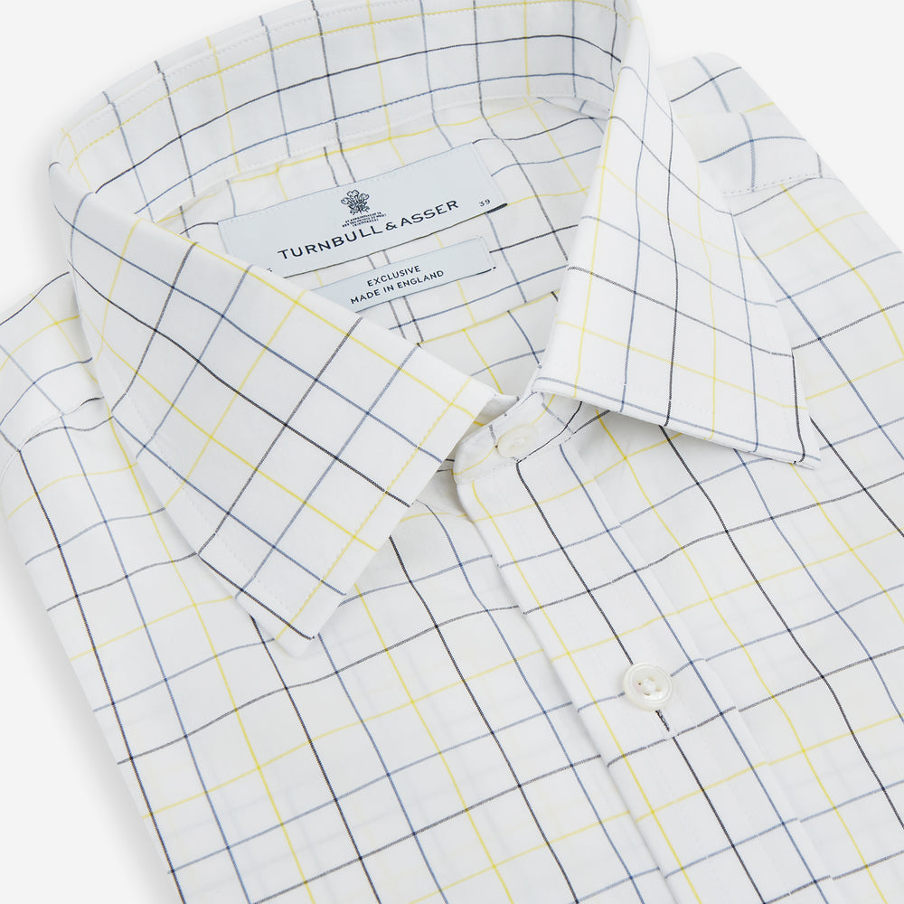 The Turnbull & Asser Yellow and Blue Grid Check Mayfair Shirt features a long-sleeve button-up design with a yellow and blue grid pattern, shown against a plain white background.